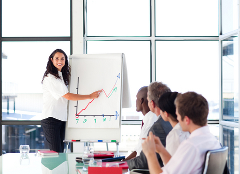 woman presenting sales figures